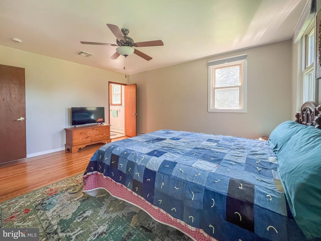 4643 Lerch Road Bensalem, PA 19020 - Photo 21 of 69 a bedroom with a bed and wooden floor