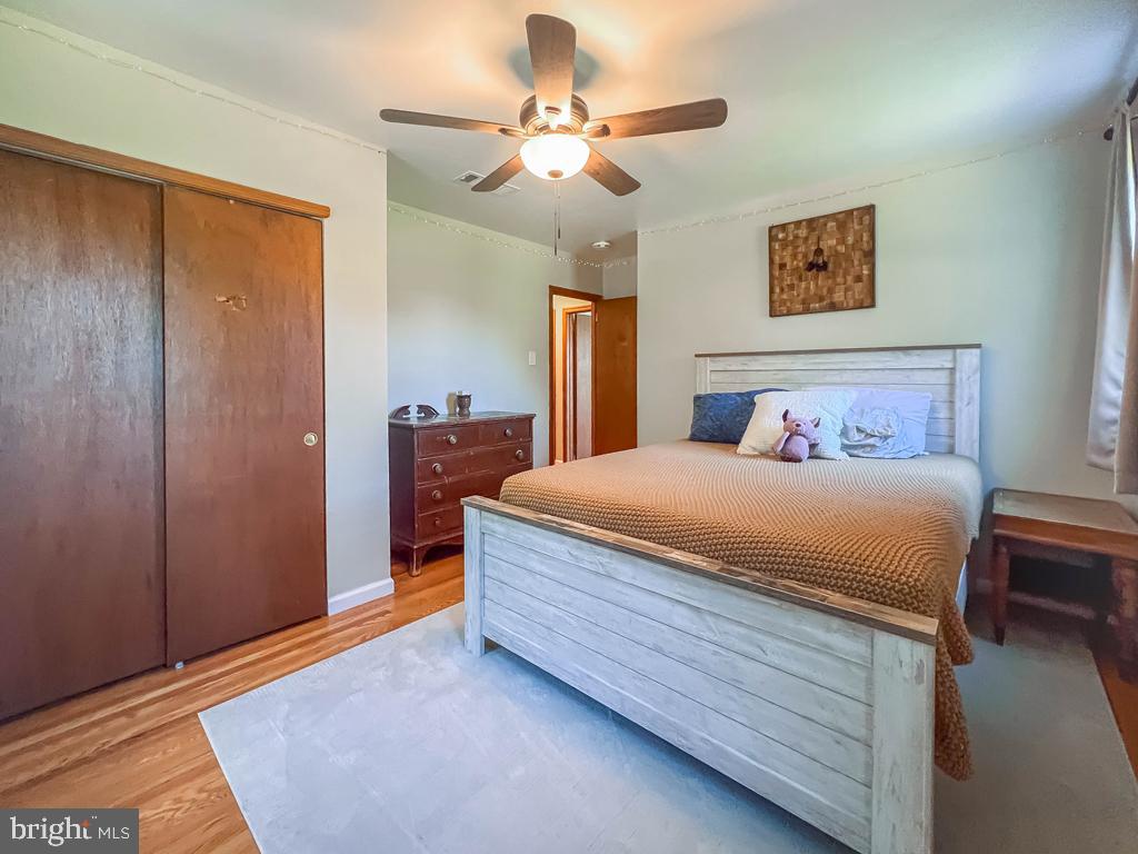 4643 Lerch Road Bensalem, PA 19020 - Photo 26 of 69 a spacious bedroom with a bed and a chandelier