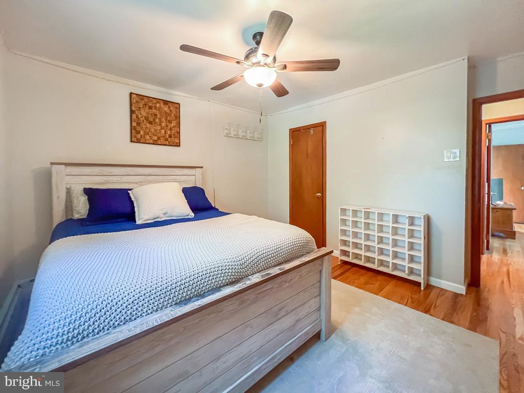 4643 Lerch Road Bensalem, PA 19020 - Photo 28 of 69 a bedroom with a large bed and a chandelier