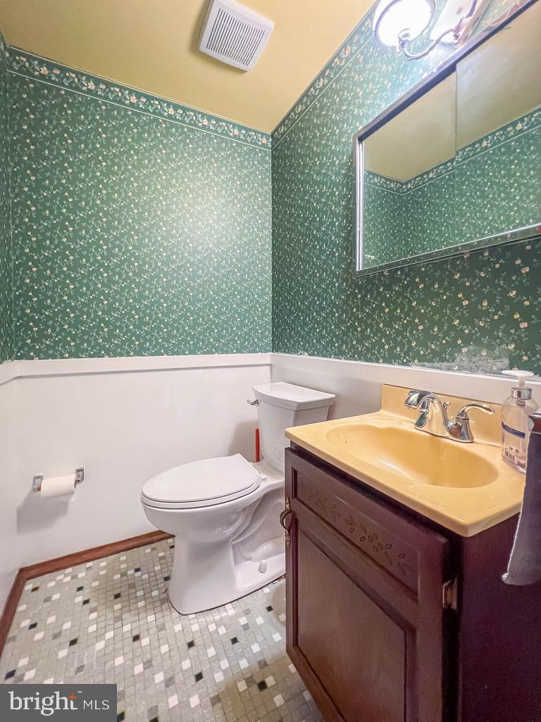 4643 Lerch Road Bensalem, PA 19020 - Photo 31 of 69 a bathroom with a sink a toilet and mirror