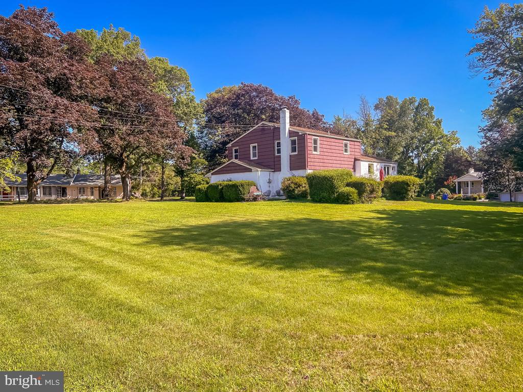 4643 Lerch Road Bensalem, PA 19020 - Photo 38 of 69 a view of a building with a big yard and large trees