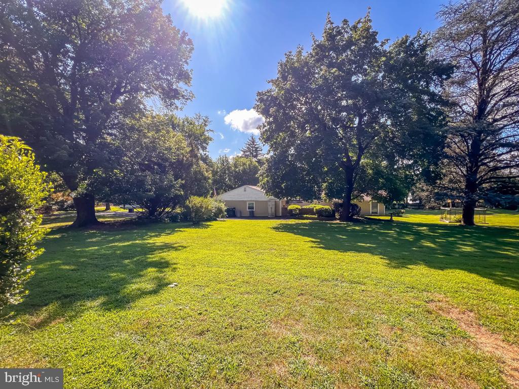 4643 Lerch Road Bensalem, PA 19020 - Photo 39 of 69 a view of swimming pool and trees in the background