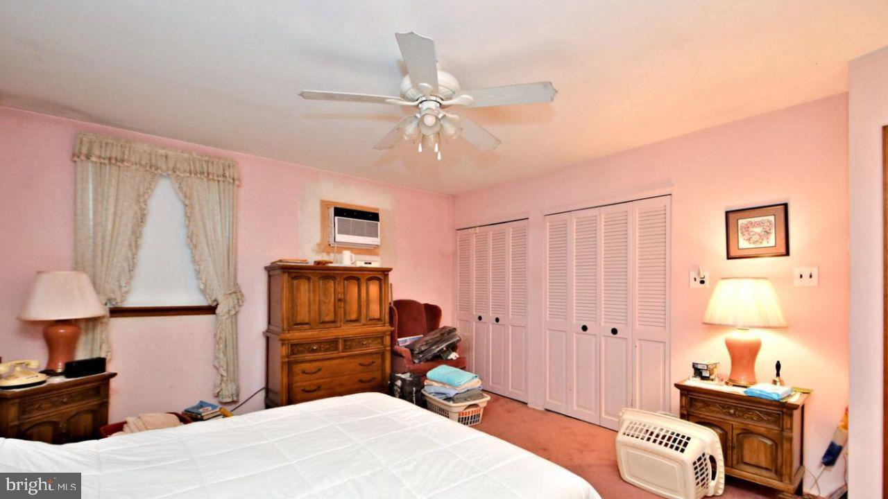 4643 Lerch Road Bensalem, PA 19020 - Photo 53 of 69 a bedroom with a bed and a chandelier