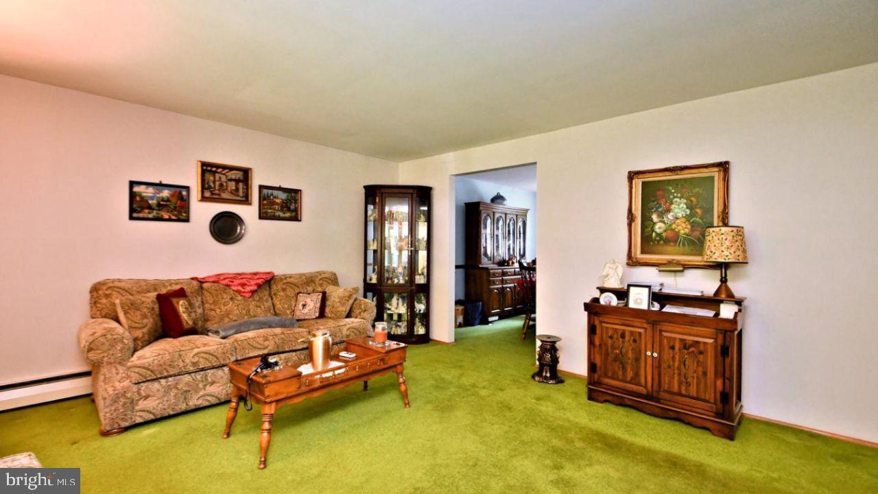 4643 Lerch Road Bensalem, PA 19020 - Photo 62 of 69 a living room with furniture and paintings on the wall