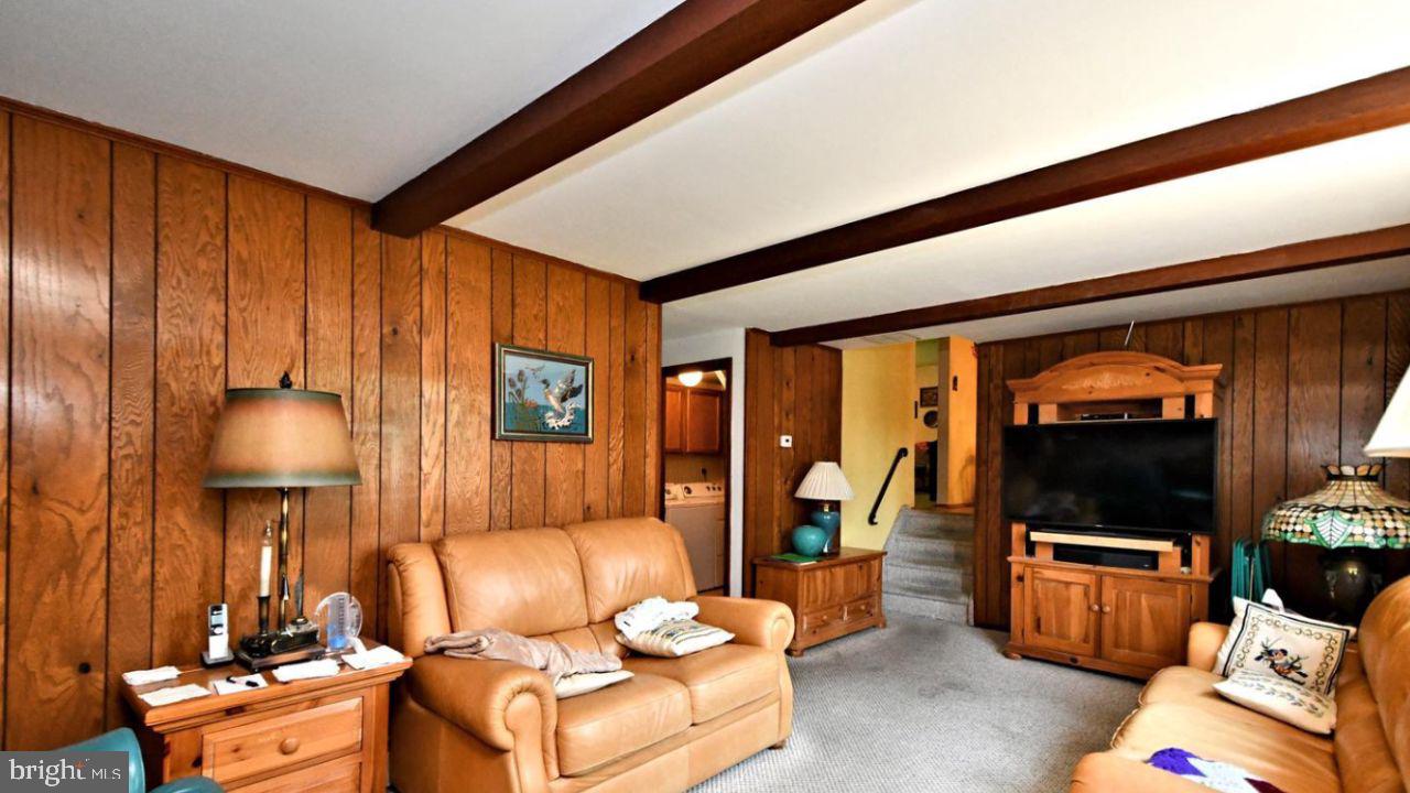 4643 Lerch Road Bensalem, PA 19020 - Photo 65 of 69 a living room with furniture a flat screen tv and a large window