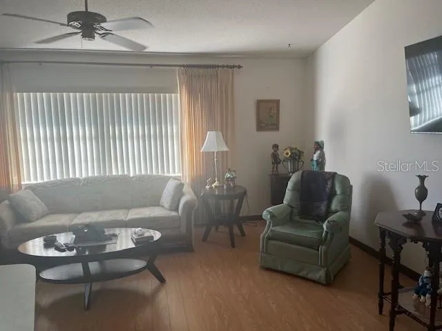 a living room with furniture and a window