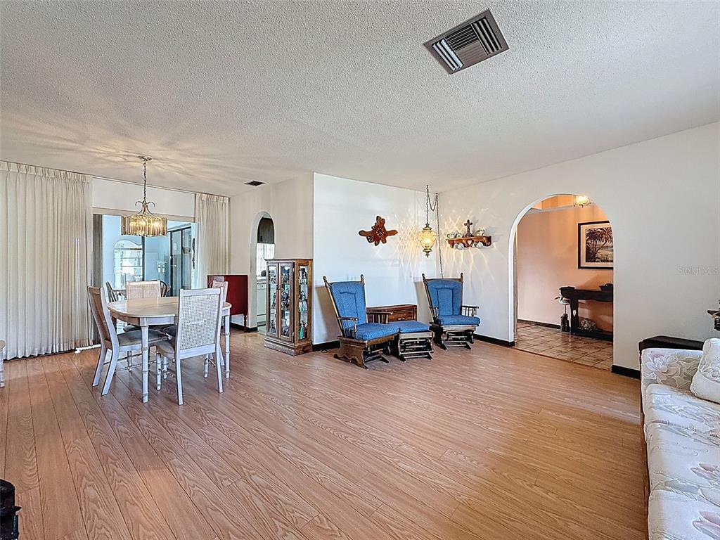 9030 Hernando Way Weeki Wachee, FL 34613 - Photo 13 of 67 a living room with furniture and a wooden floor