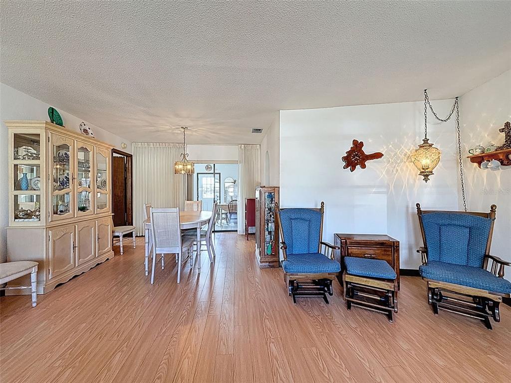 9030 Hernando Way Weeki Wachee, FL 34613 - Photo 14 of 67 a living room with furniture and wooden floor