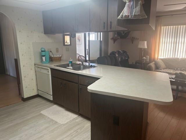 9030 Hernando Way Weeki Wachee, FL 34613 - Photo 15 of 40 a kitchen with a sink and wooden cabinets