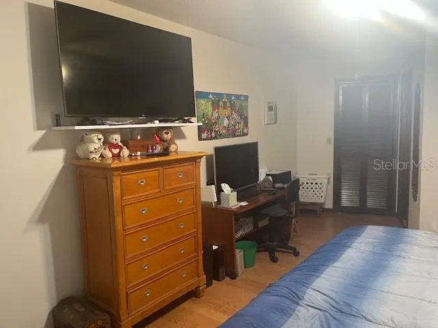 a view of a livingroom with furniture and a flat screen tv