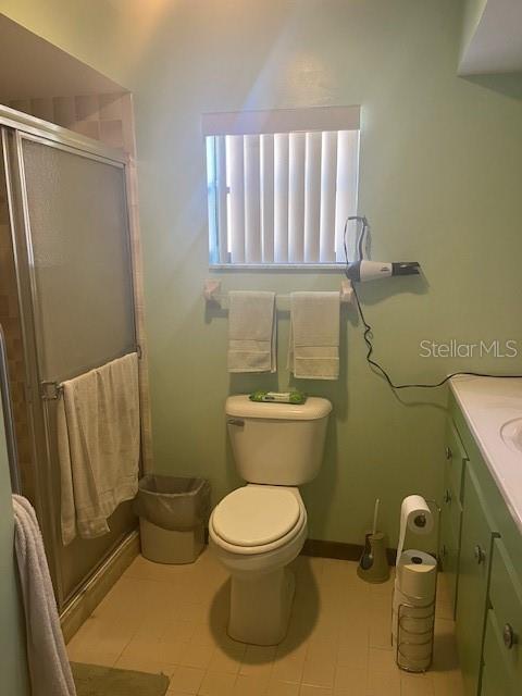 9030 Hernando Way Weeki Wachee, FL 34613 - Photo 23 of 40 a bathroom with a toilet and a shower