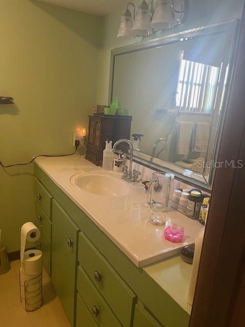 9030 Hernando Way Weeki Wachee, FL 34613 - Photo 24 of 40 a bathroom with a sink and a mirror