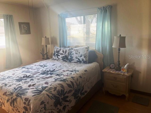 9030 Hernando Way Weeki Wachee, FL 34613 - Photo 26 of 40 a bedroom with a bed and a window