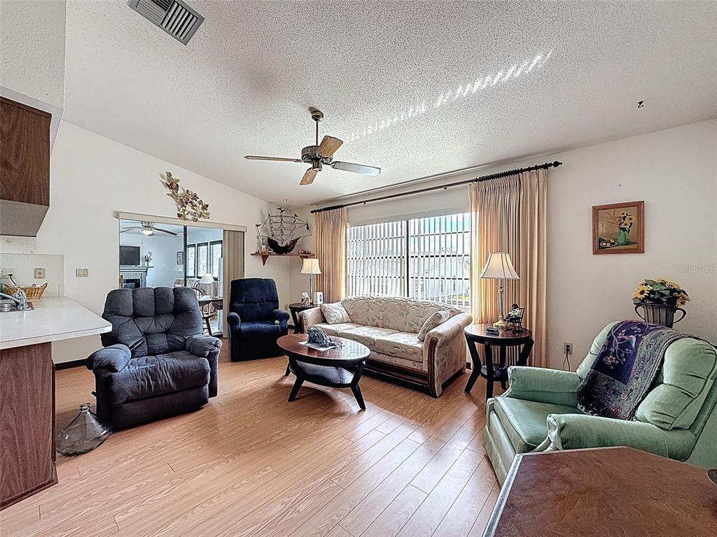 9030 Hernando Way Weeki Wachee, FL 34613 - Photo 26 of 67 a living room with furniture and a large window