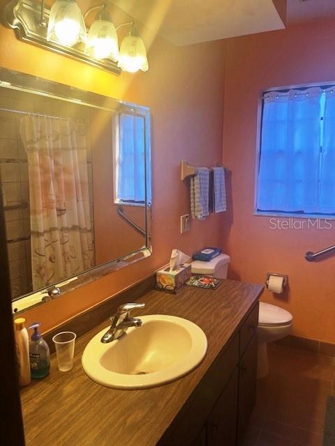 9030 Hernando Way Weeki Wachee, FL 34613 - Photo 30 of 40 a bathroom with a sink and a mirror