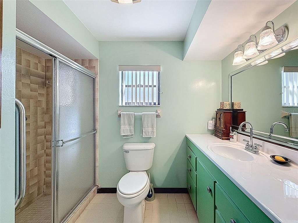 9030 Hernando Way Weeki Wachee, FL 34613 - Photo 36 of 67 a bathroom with a sink toilet and shower