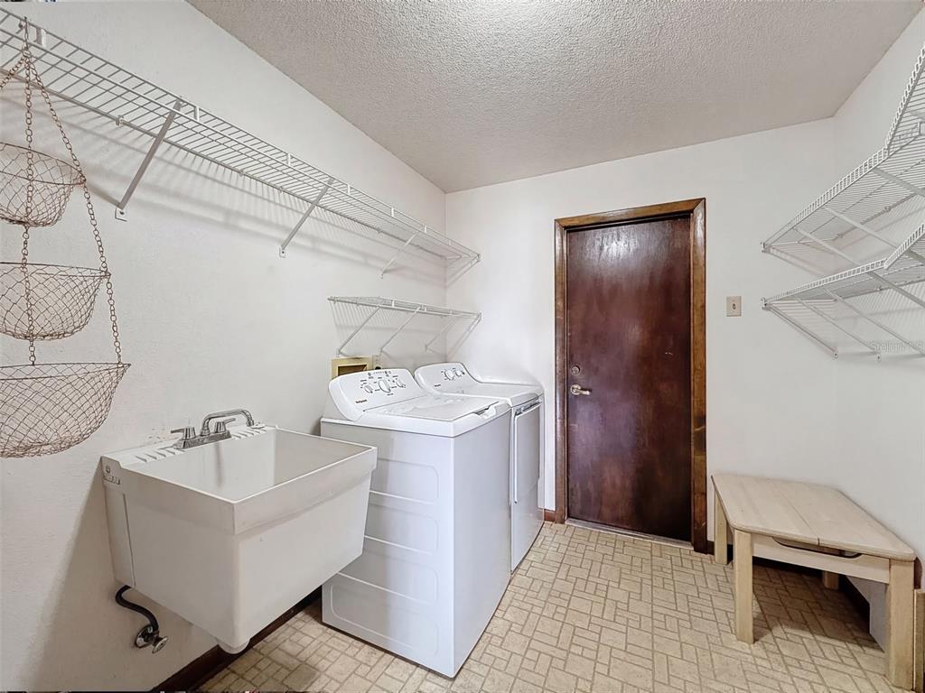 9030 Hernando Way Weeki Wachee, FL 34613 - Photo 50 of 67 a bathroom with a sink and mirror