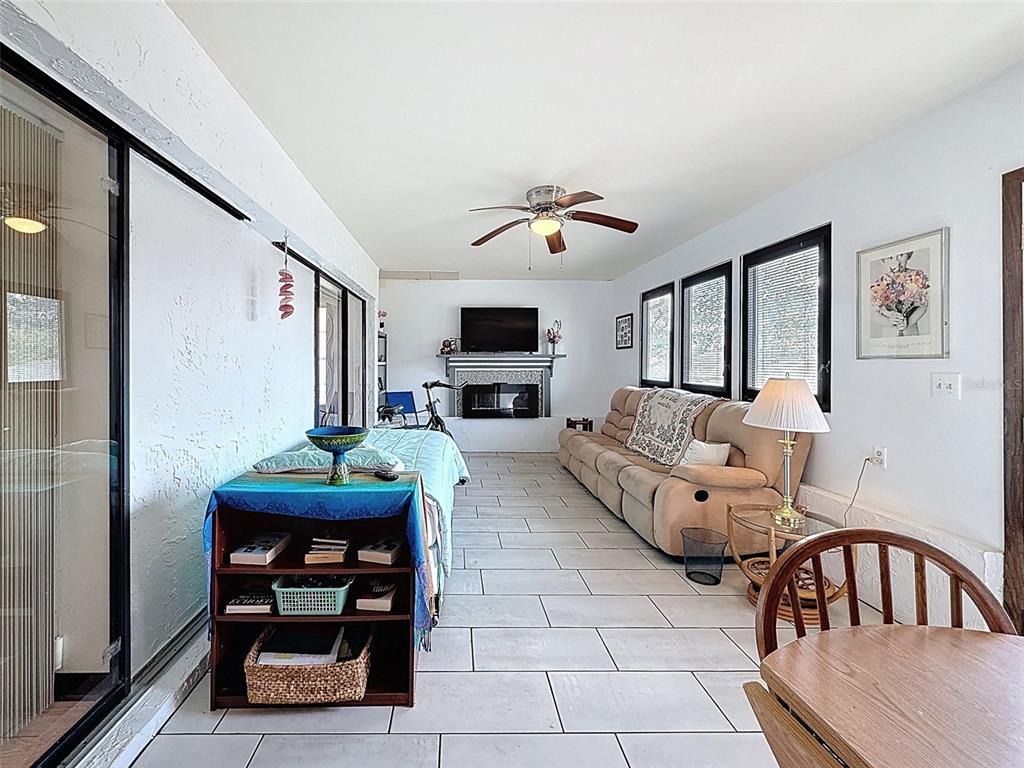 9030 Hernando Way Weeki Wachee, FL 34613 - Photo 56 of 67 a living room with furniture and a flat screen tv