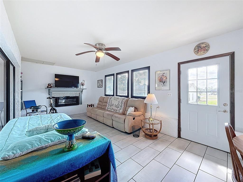 9030 Hernando Way Weeki Wachee, FL 34613 - Photo 57 of 67 a living room with furniture a flat screen tv and a window
