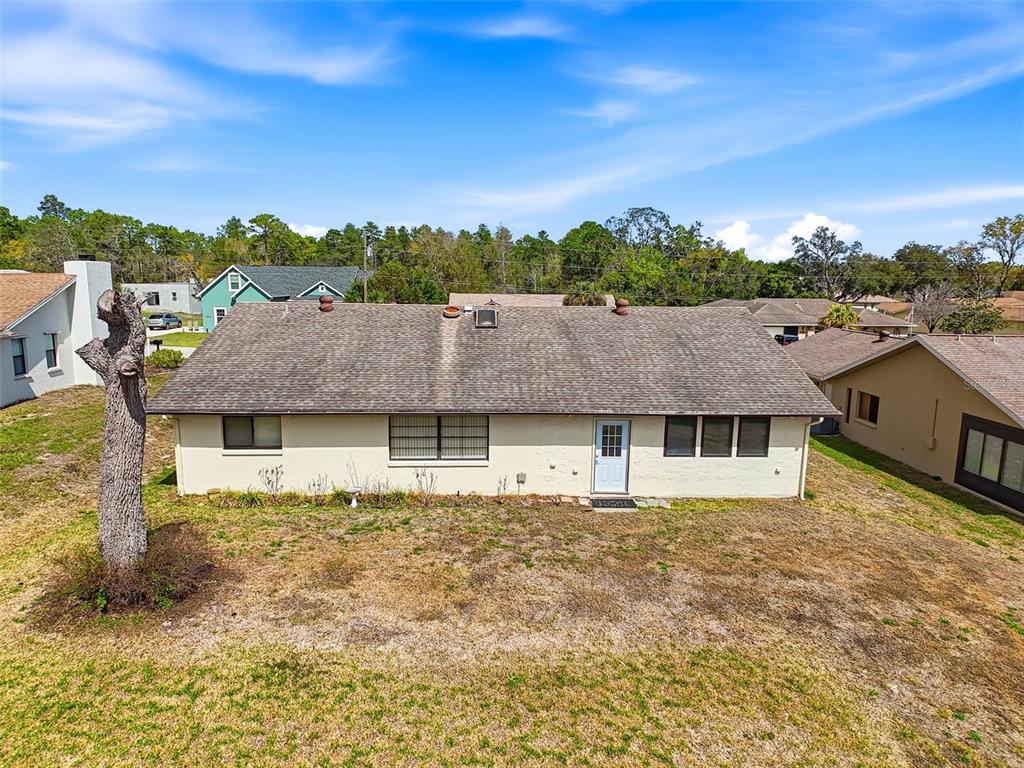 9030 Hernando Way Weeki Wachee, FL 34613 - Photo 59 of 67 front view of a house with a yard