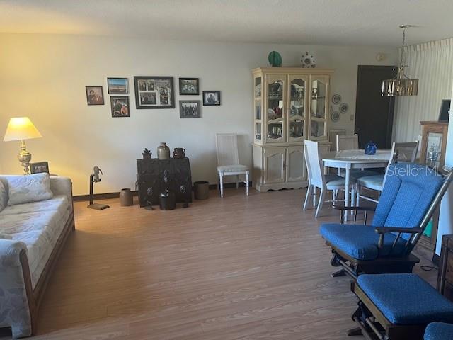 9030 Hernando Way Weeki Wachee, FL 34613 - Photo 7 of 40 a living room with furniture and wooden floor