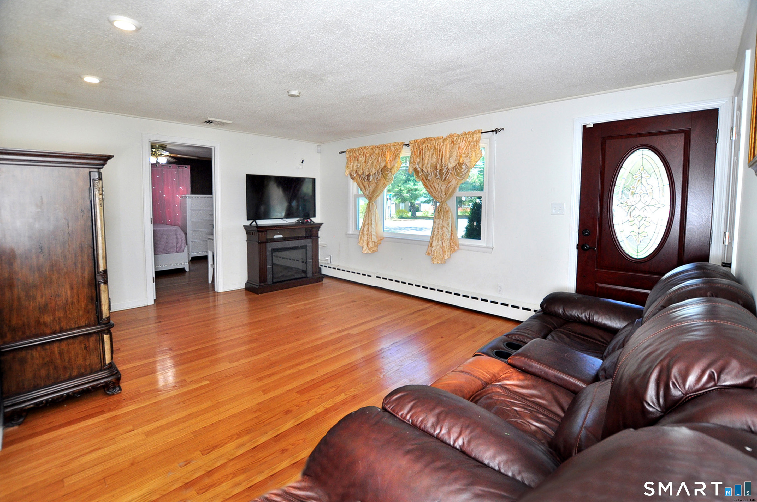 234 South Elm Street Windsor Locks, CT 06096 - Photo 12 of 33 a living room with furniture and a flat screen tv