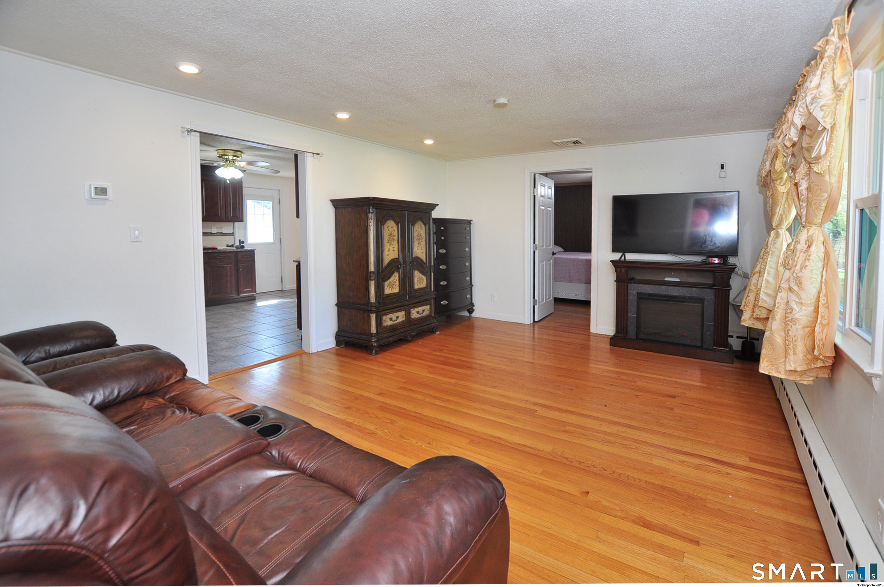 234 South Elm Street Windsor Locks, CT 06096 - Photo 13 of 33 a living room with furniture and a flat screen tv