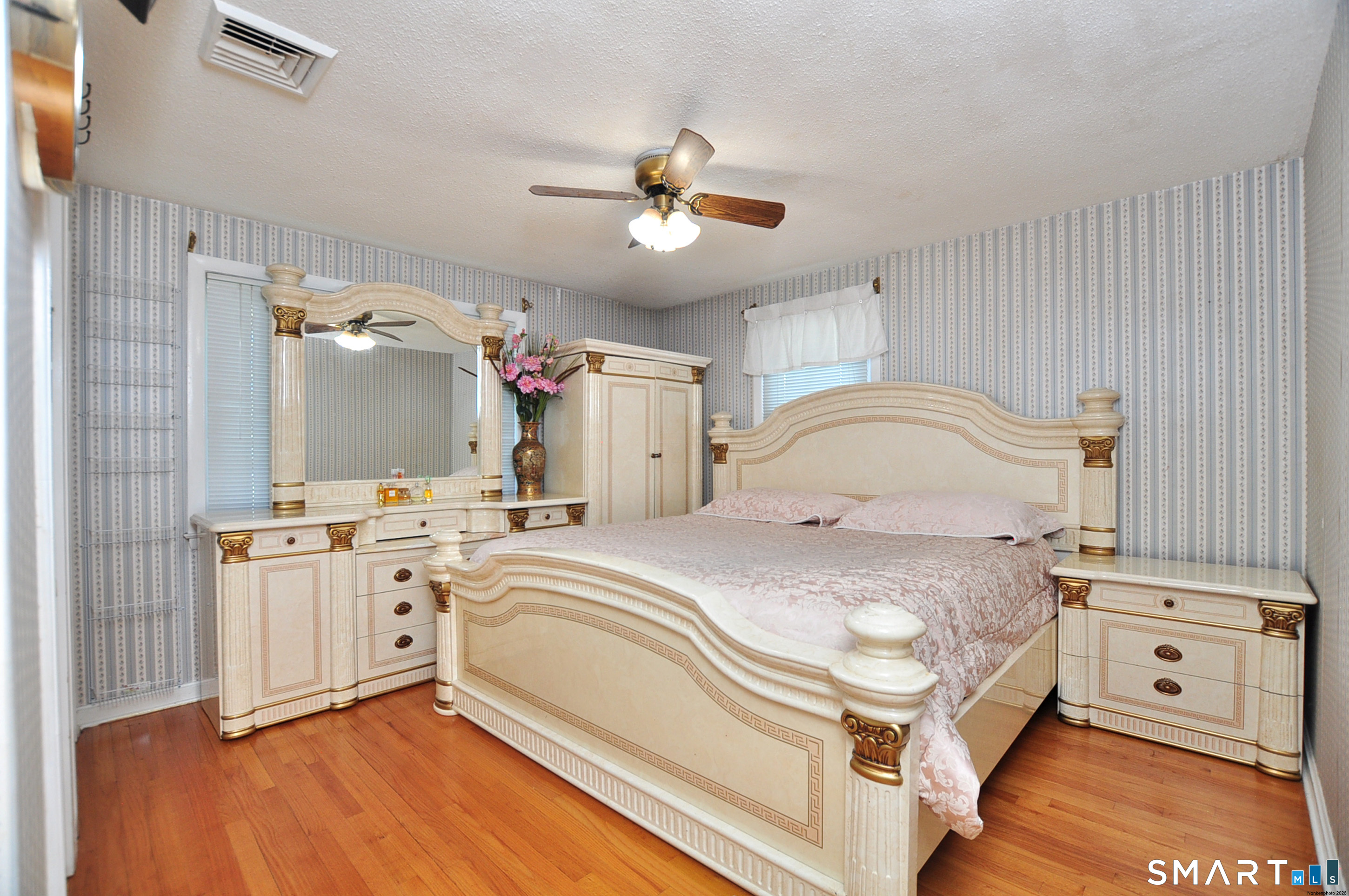 234 South Elm Street Windsor Locks, CT 06096 - Photo 17 of 33 a spacious bedroom with a bed and a chandelier