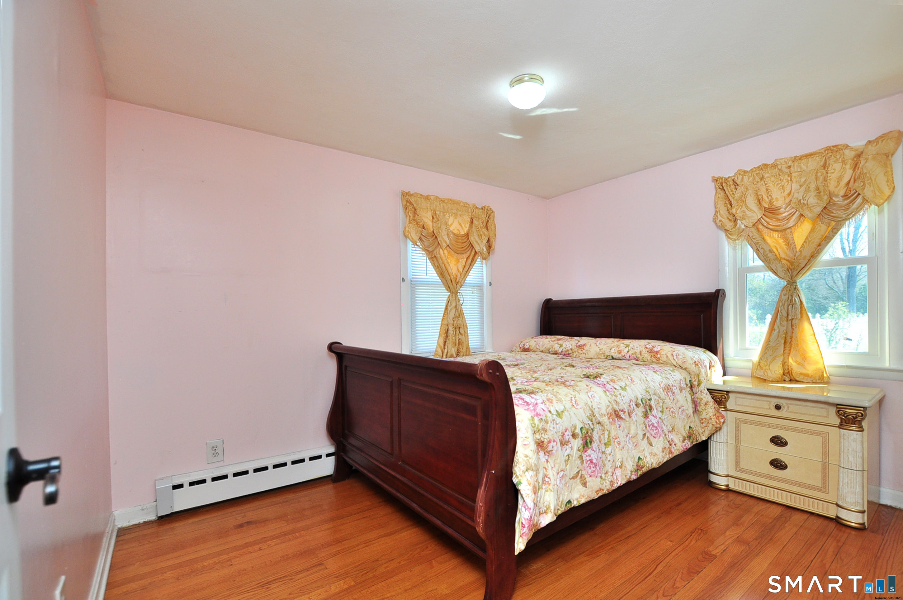 234 South Elm Street Windsor Locks, CT 06096 - Photo 18 of 33 a bedroom with a bed and window