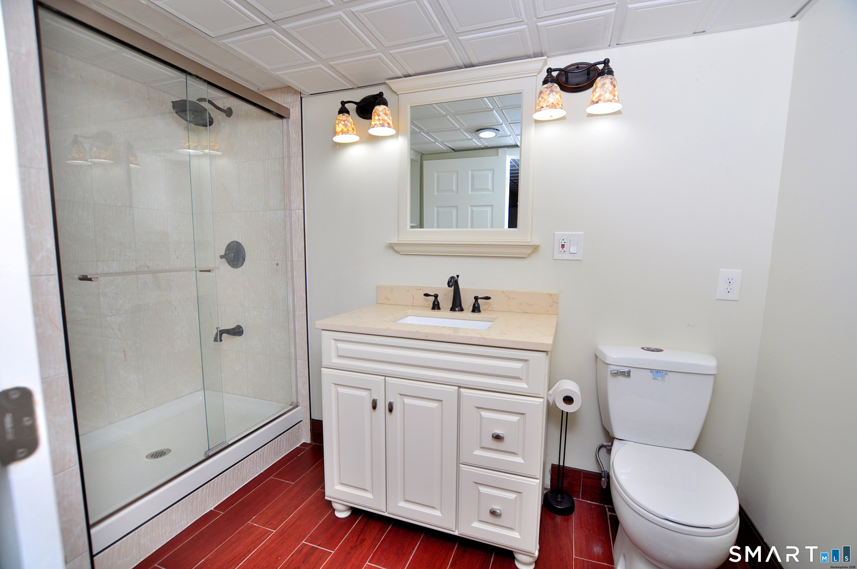 234 South Elm Street Windsor Locks, CT 06096 - Photo 25 of 33 a bathroom with a sink a toilet and shower