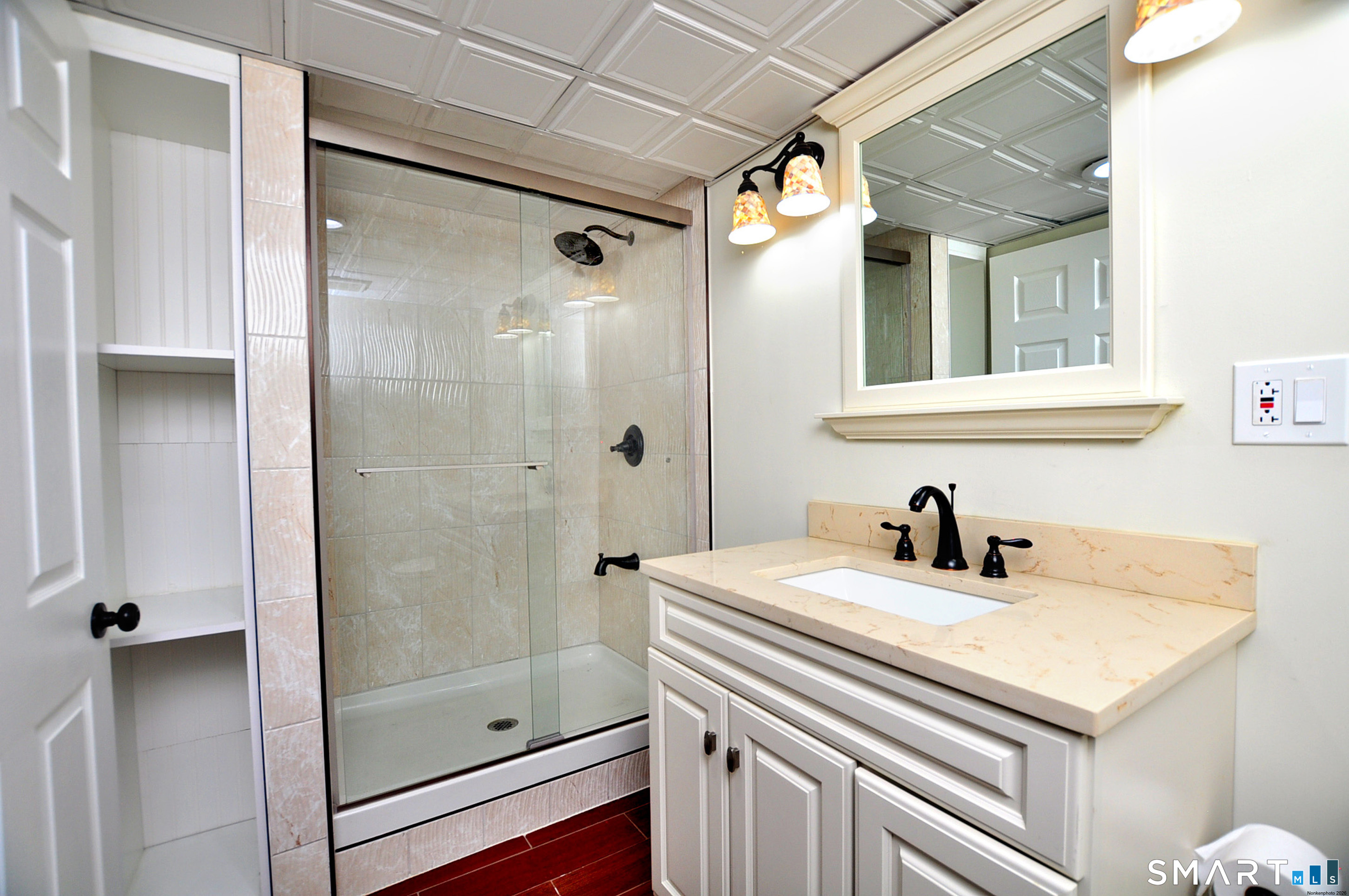 234 South Elm Street Windsor Locks, CT 06096 - Photo 26 of 33 a bathroom with a sink a shower and a mirror