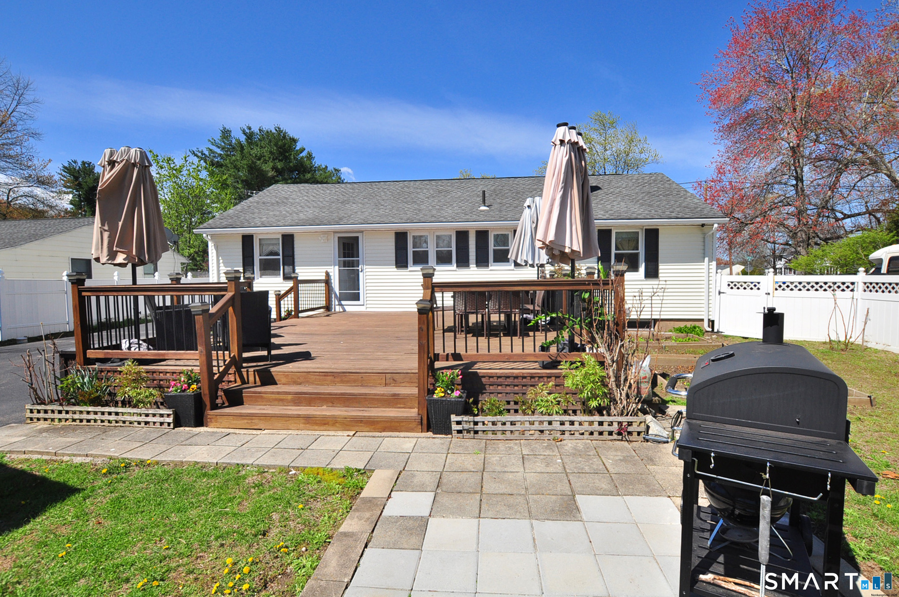 234 South Elm Street Windsor Locks, CT 06096 - Photo 27 of 33 a view of a dinning table and chairs in patio of the house