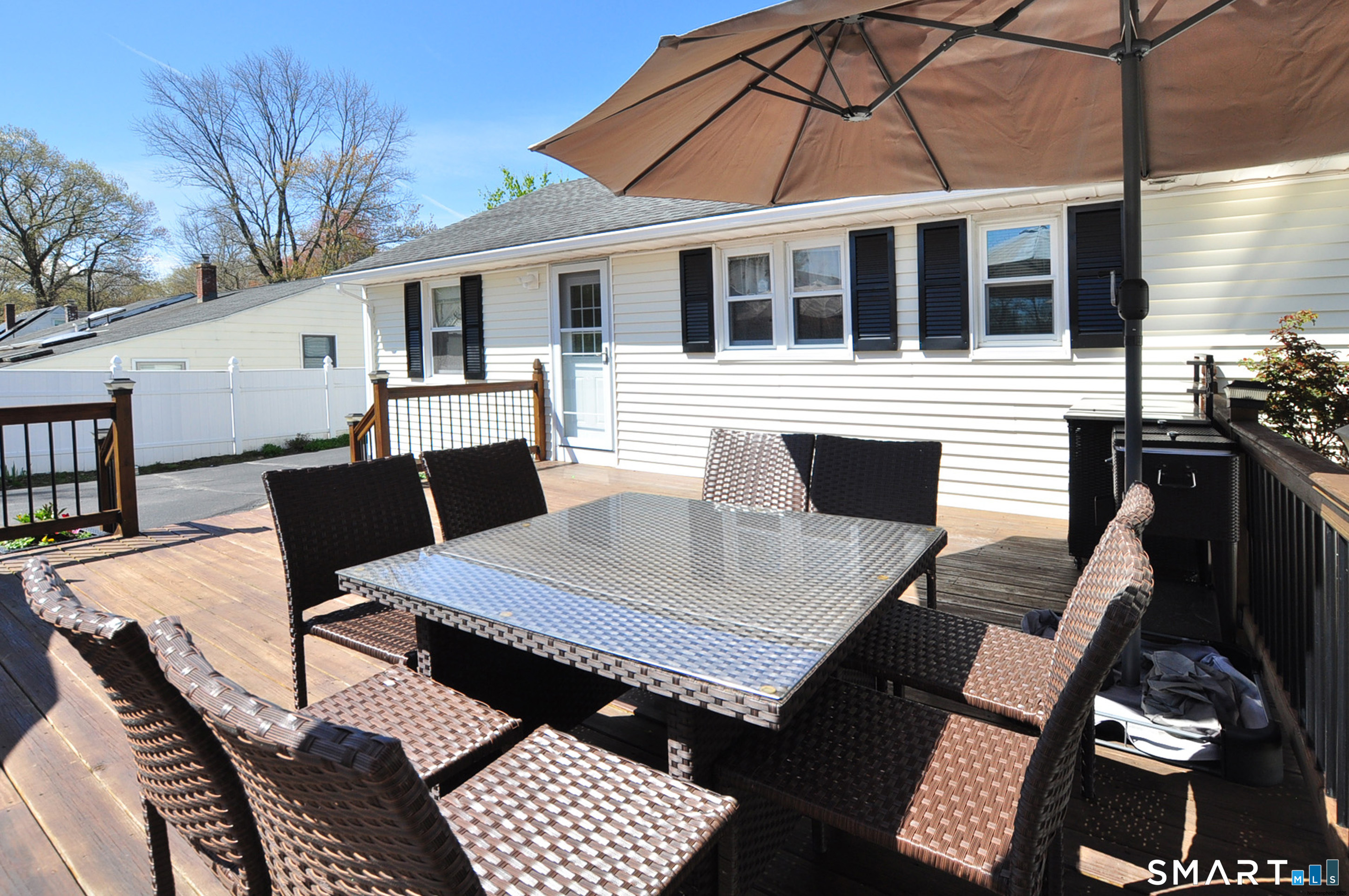 234 South Elm Street Windsor Locks, CT 06096 - Photo 29 of 33 a view of a patio with table and chairs with wooden floor and fence