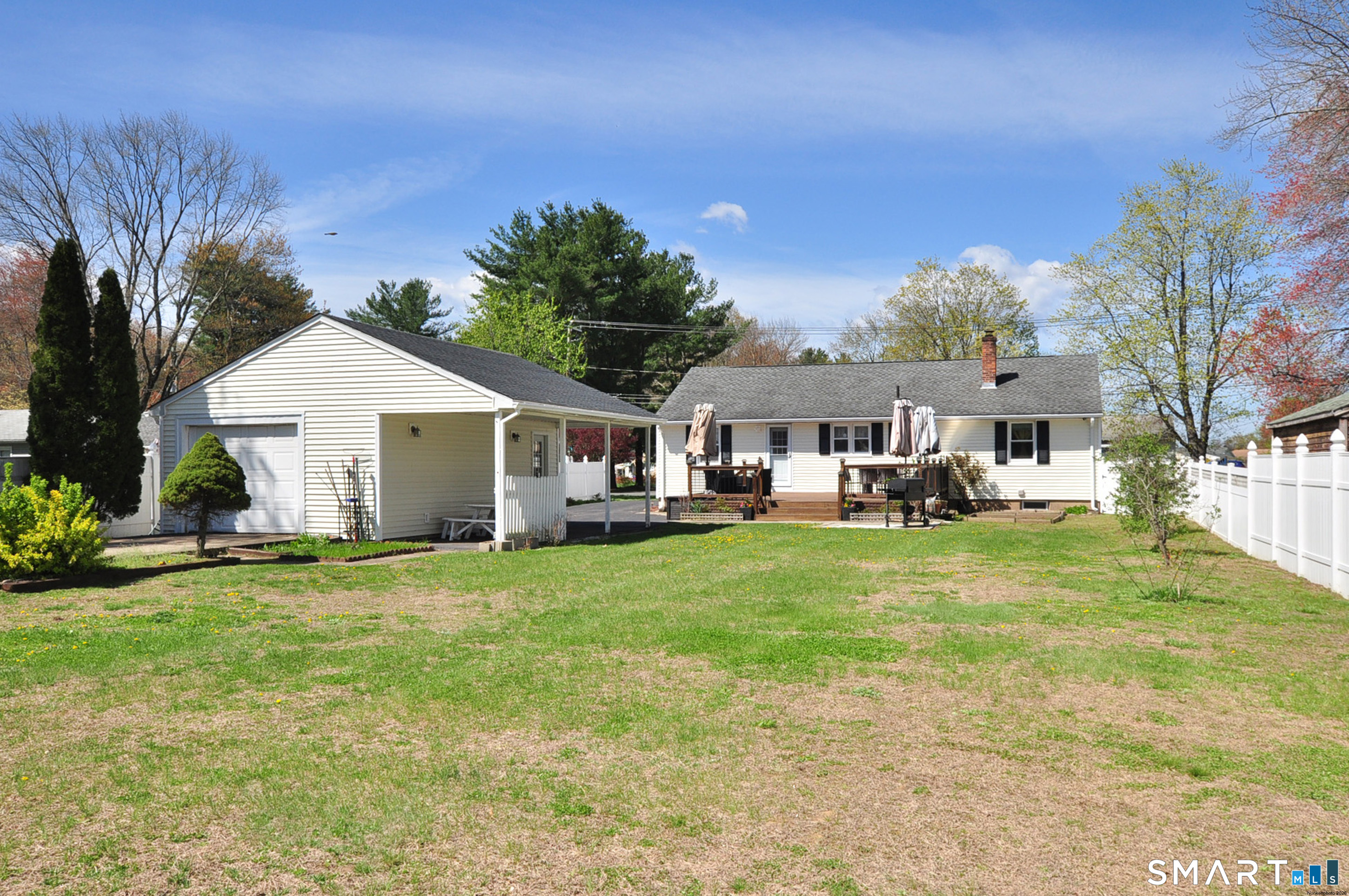 234 South Elm Street Windsor Locks, CT 06096 - Photo 5 of 33 a view of a house with a big yard and large trees