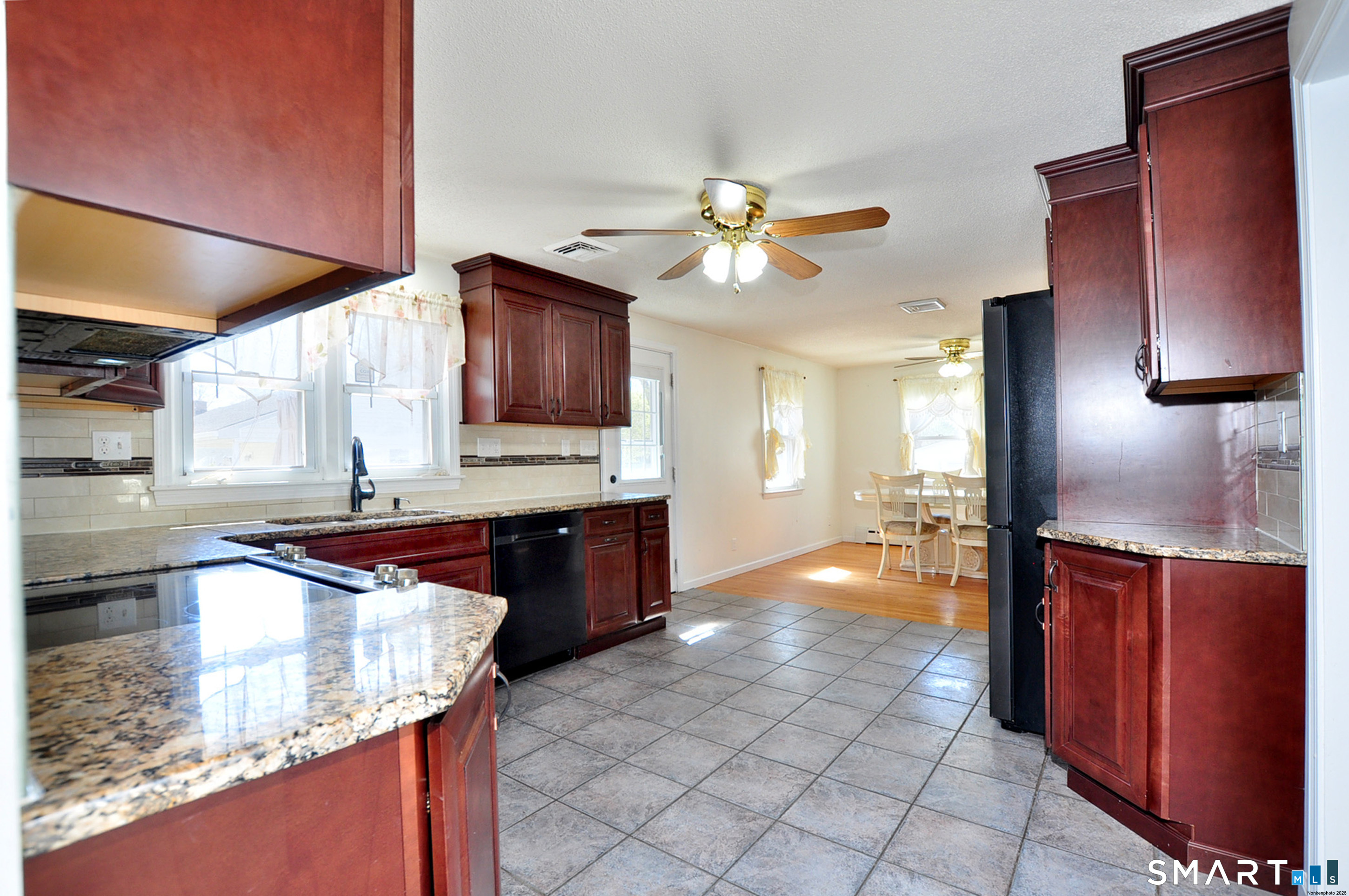 234 South Elm Street Windsor Locks, CT 06096 - Photo 8 of 33 a kitchen with stainless steel appliances granite countertop a sink and a stove top oven