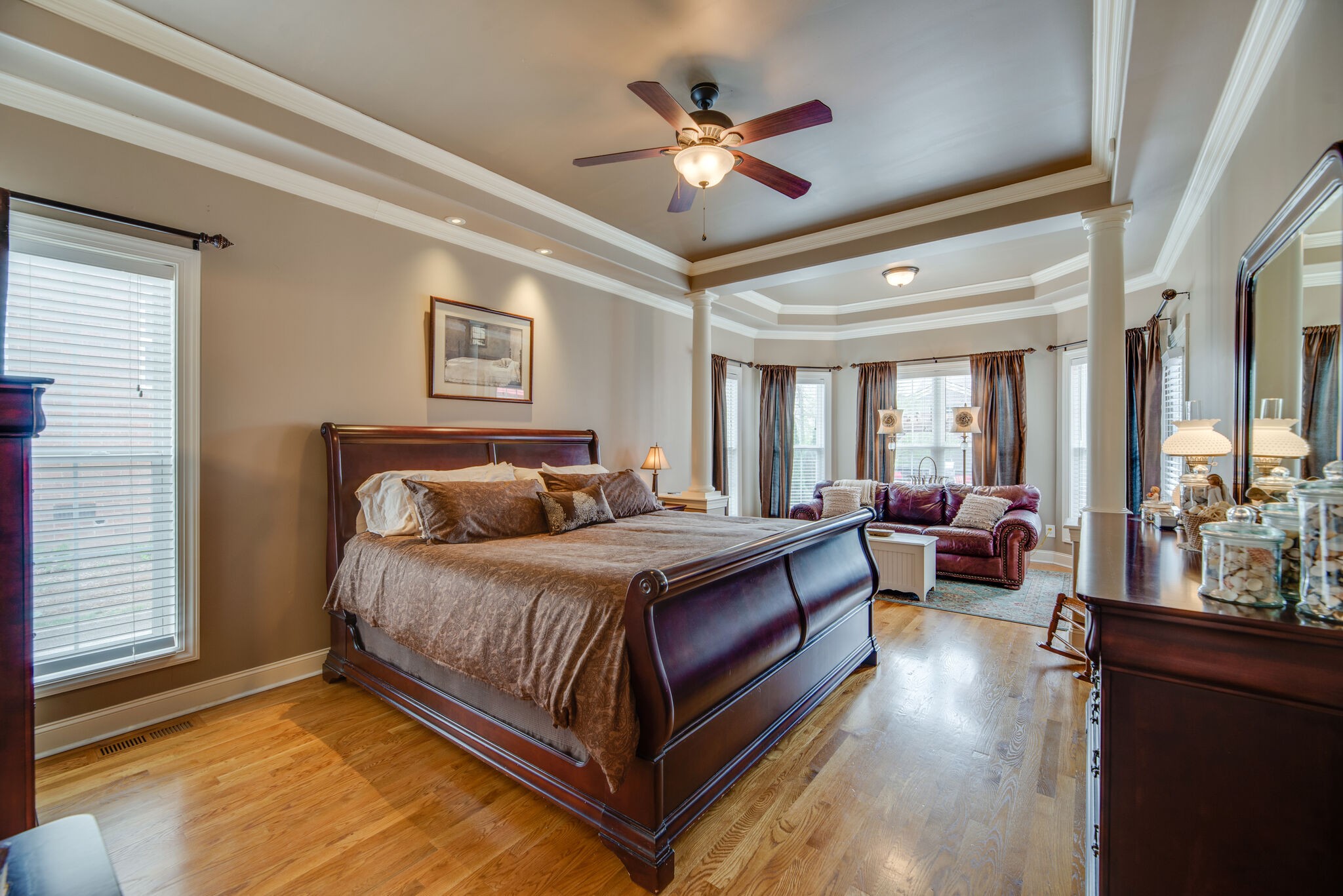 1215 White Rock Road Spring Hill, TN 37174 - Photo 16 of 42 a spacious bedroom with a bed and a chandelier