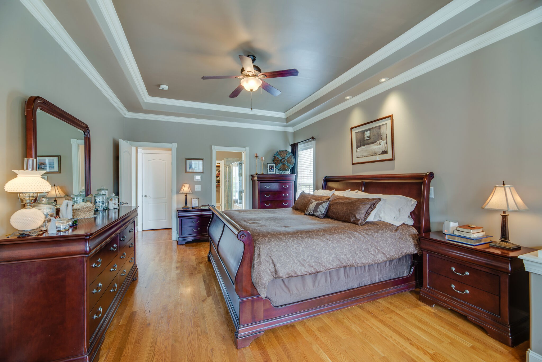 1215 White Rock Road Spring Hill, TN 37174 - Photo 17 of 42 a bedroom with a bed and a chandelier