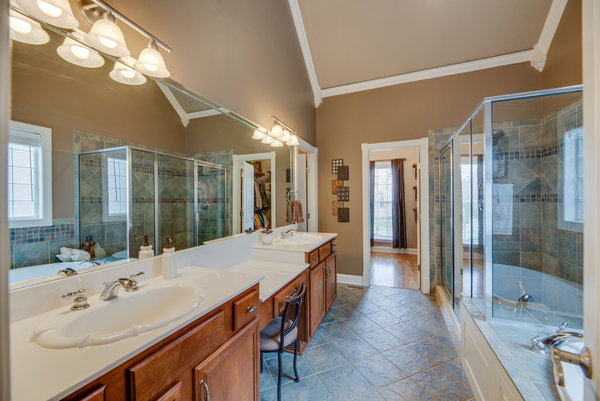 1215 White Rock Road Spring Hill, TN 37174 - Photo 19 of 42 a spacious bathroom with a sink shower and a mirror