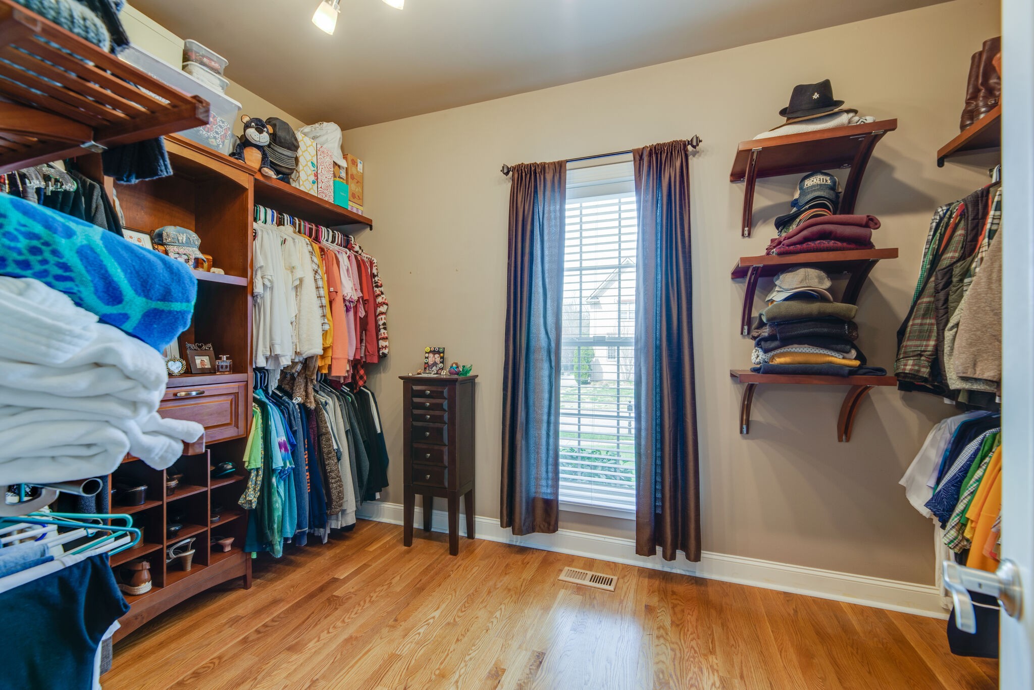 1215 White Rock Road Spring Hill, TN 37174 - Photo 21 of 42 a view of walk in closet with clothes and shoes