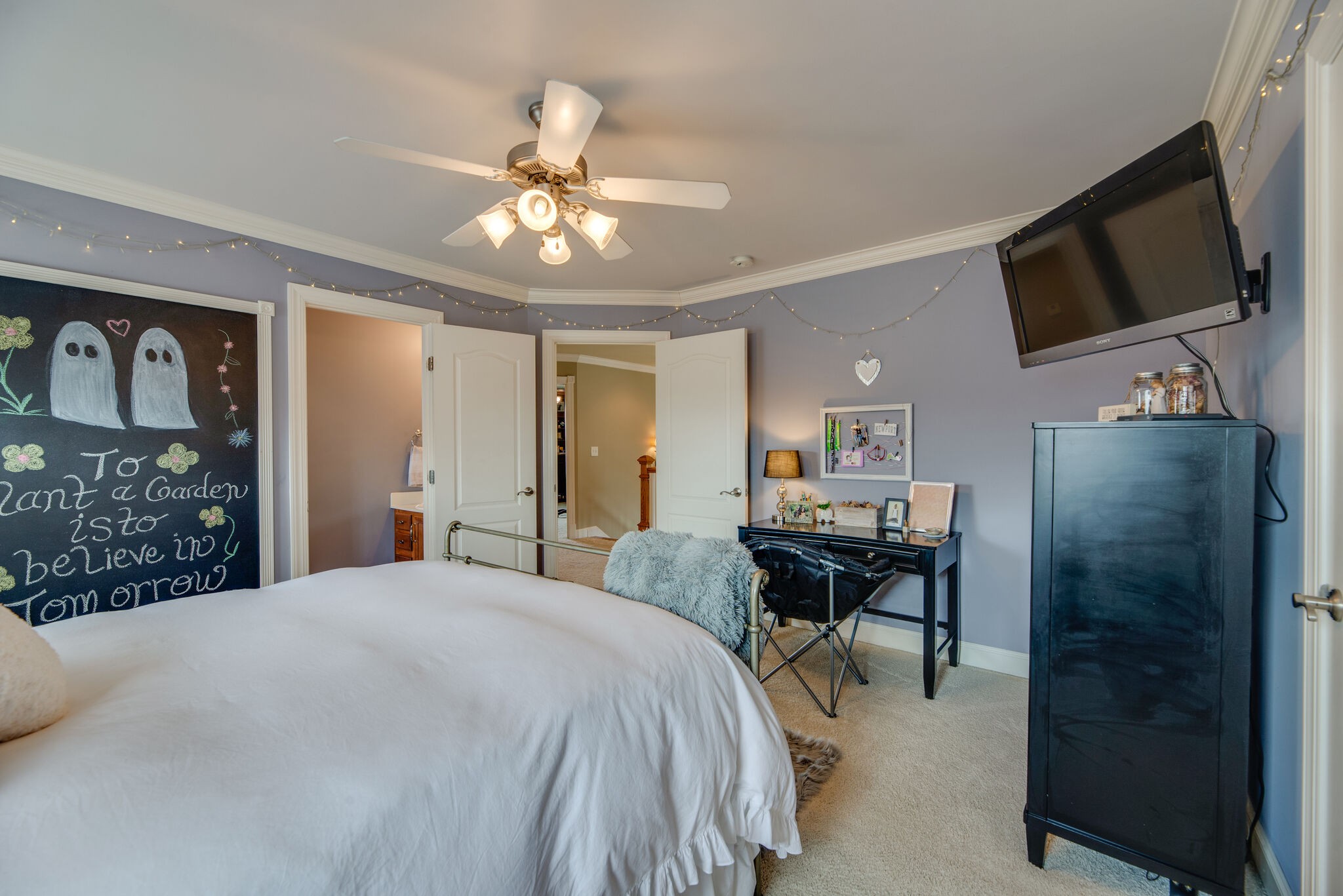1215 White Rock Road Spring Hill, TN 37174 - Photo 31 of 42 a bedroom with a bed window and a flat screen tv