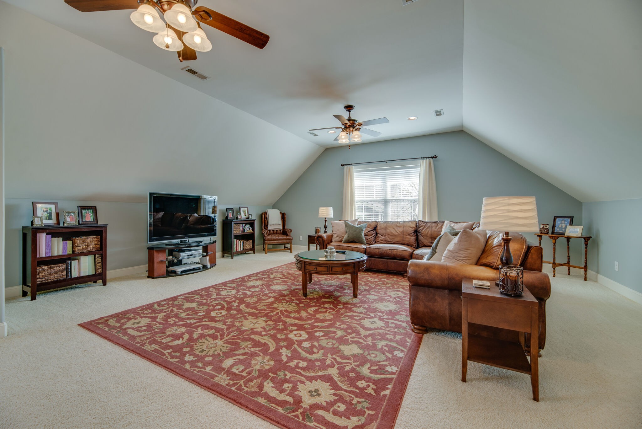 1215 White Rock Road Spring Hill, TN 37174 - Photo 35 of 42 a living room with furniture and a flat screen tv