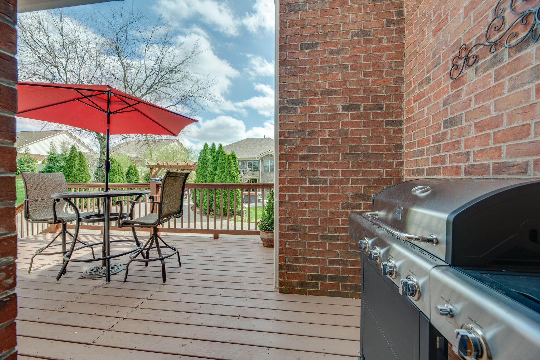 1215 White Rock Road Spring Hill, TN 37174 - Photo 38 of 42 a view of a balcony with chairs and wooden floor