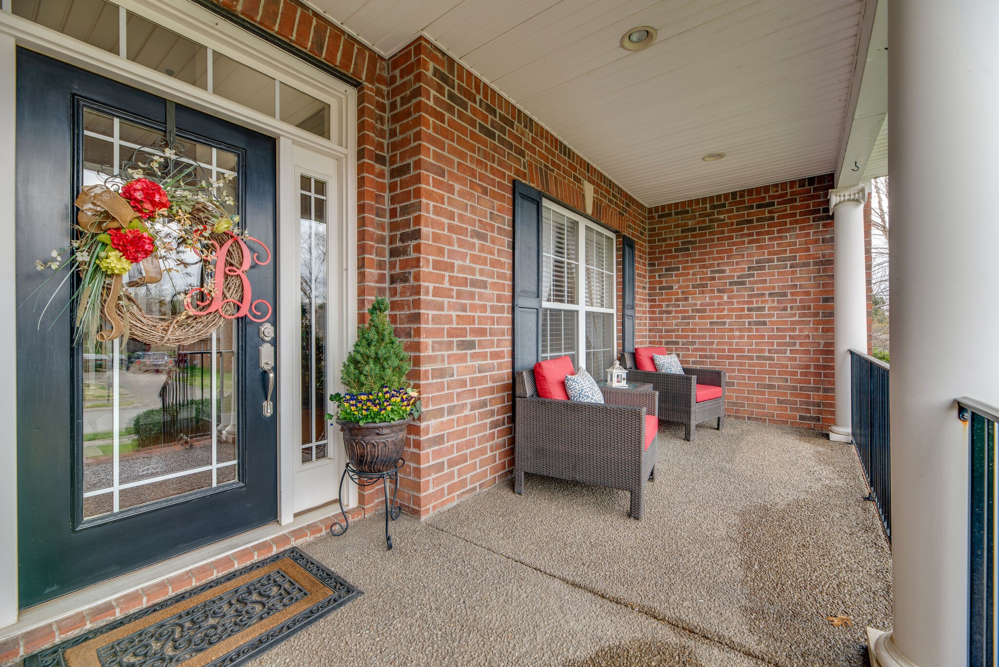 1215 White Rock Road Spring Hill, TN 37174 - Photo 6 of 42 a outdoor living space with furniture and a potted plant