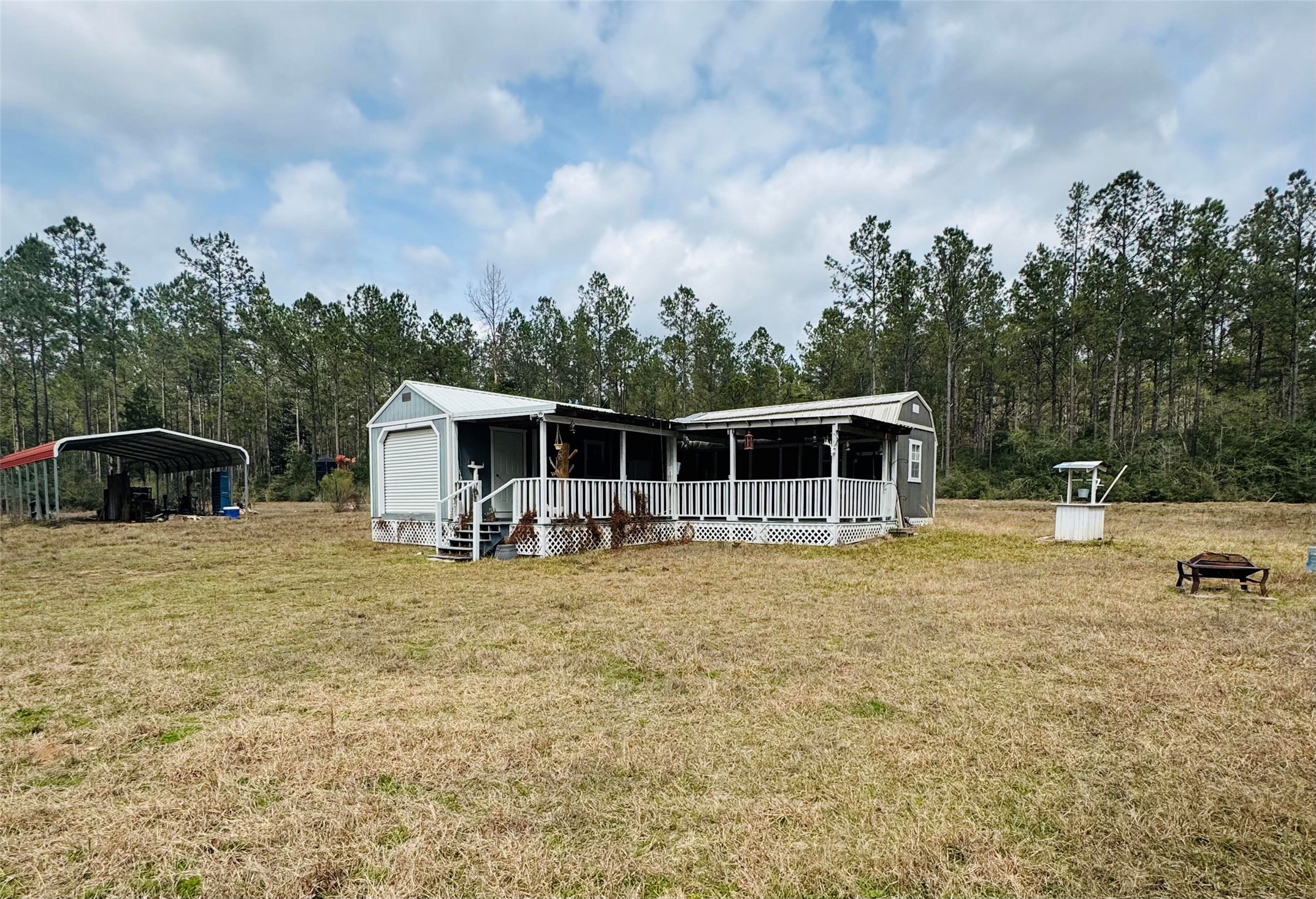2071 Camp Seale Road Livingston, TX 77351 - Photo 1 of 28 a house view with a garden space