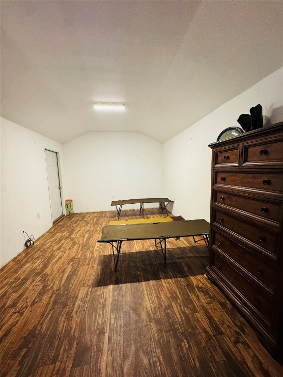 2071 Camp Seale Road Livingston, TX 77351 - Photo 17 of 28 a view of a bedroom with wooden floor and stairs