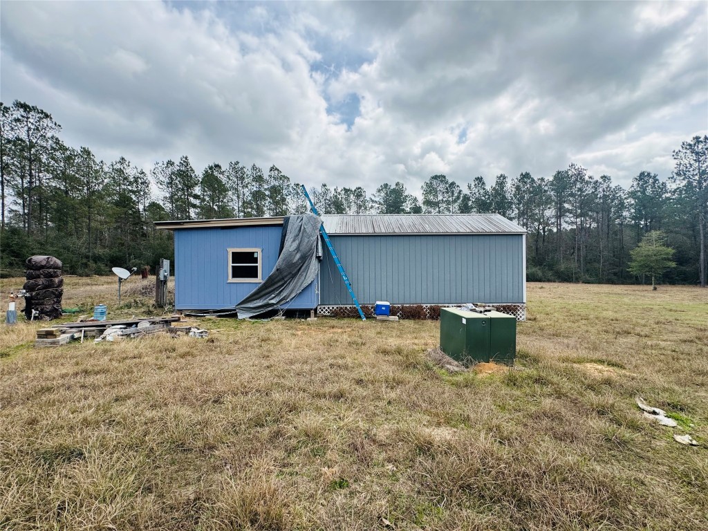 2071 Camp Seale Road Livingston, TX 77351 - Photo 22 of 28 a view of a house with backyard