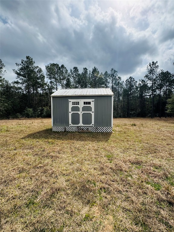 2071 Camp Seale Road Livingston, TX 77351 - Photo 23 of 28 a house view with a backyard space
