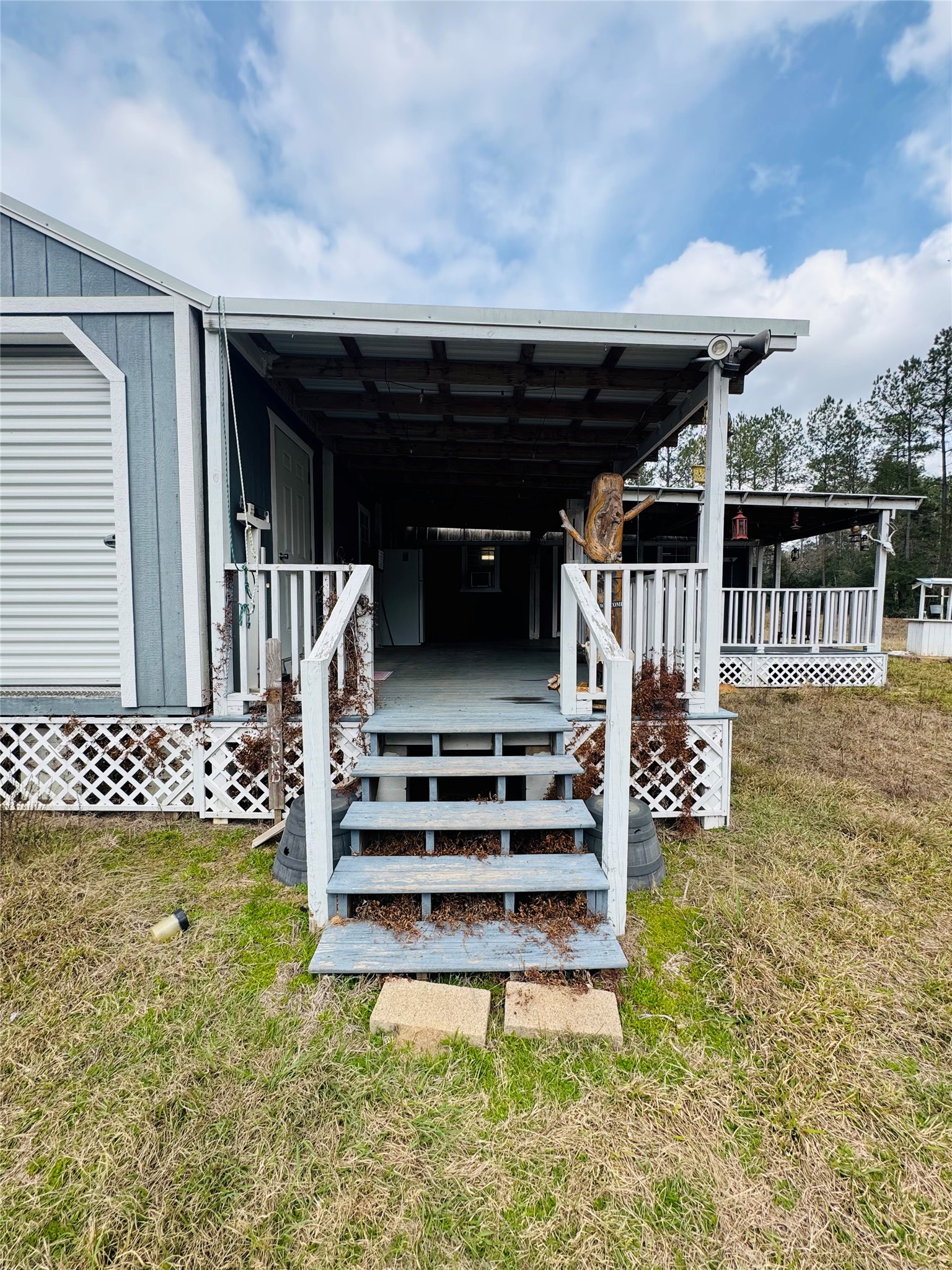 2071 Camp Seale Road Livingston, TX 77351 - Photo 7 of 28 a view of a chair and tables in the patio