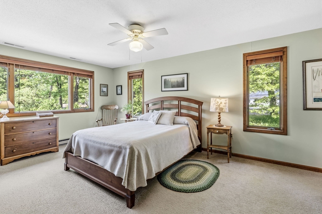 788 Burts Pit Road Northampton, MA 01062 - Photo 20 of 42 a bedroom with a bed and a table