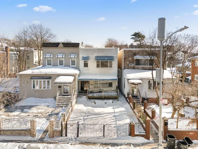 a front view of a building with parking space